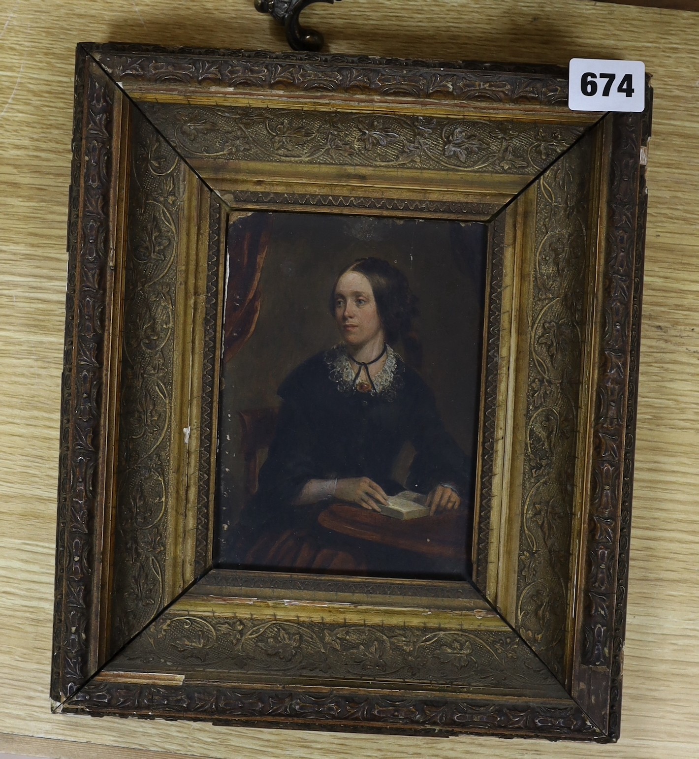 English School, mid 19th century, oil on board, Half length portrait of a seated Victorian lady, 16 x 11cm